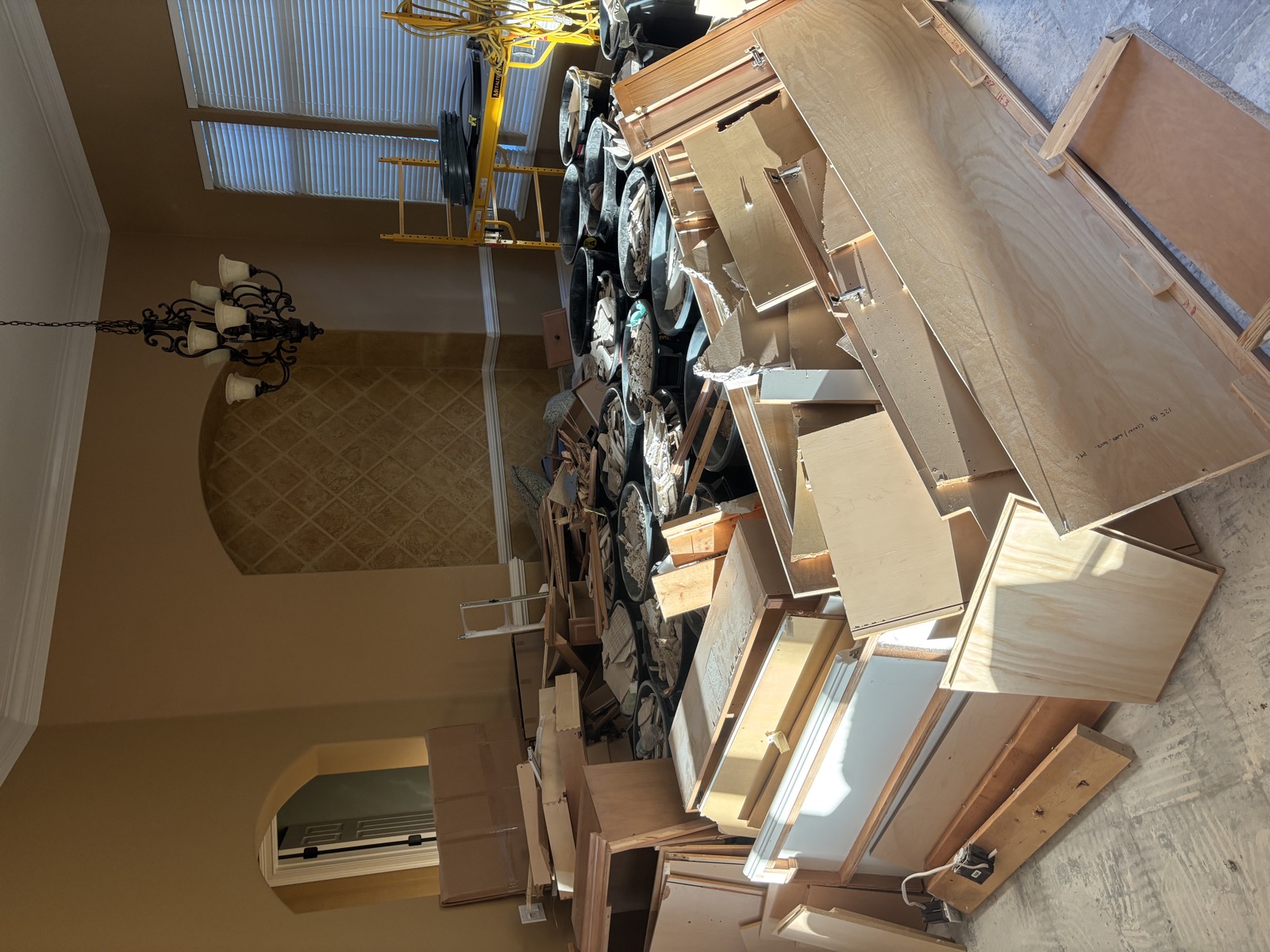 Room full of old cabinets and furniture ready for junk removal