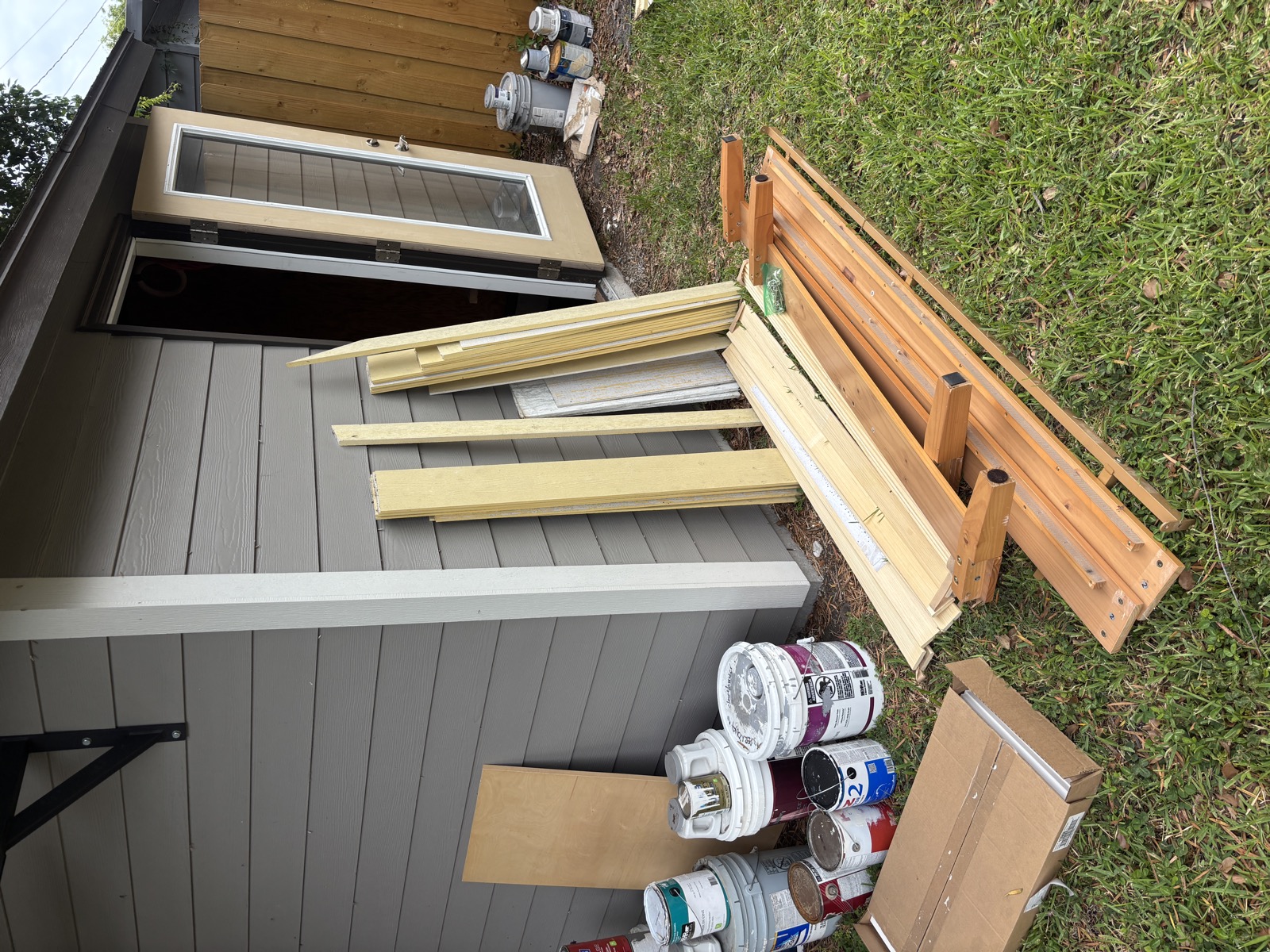 Old door and lumber ready for construction debris removal